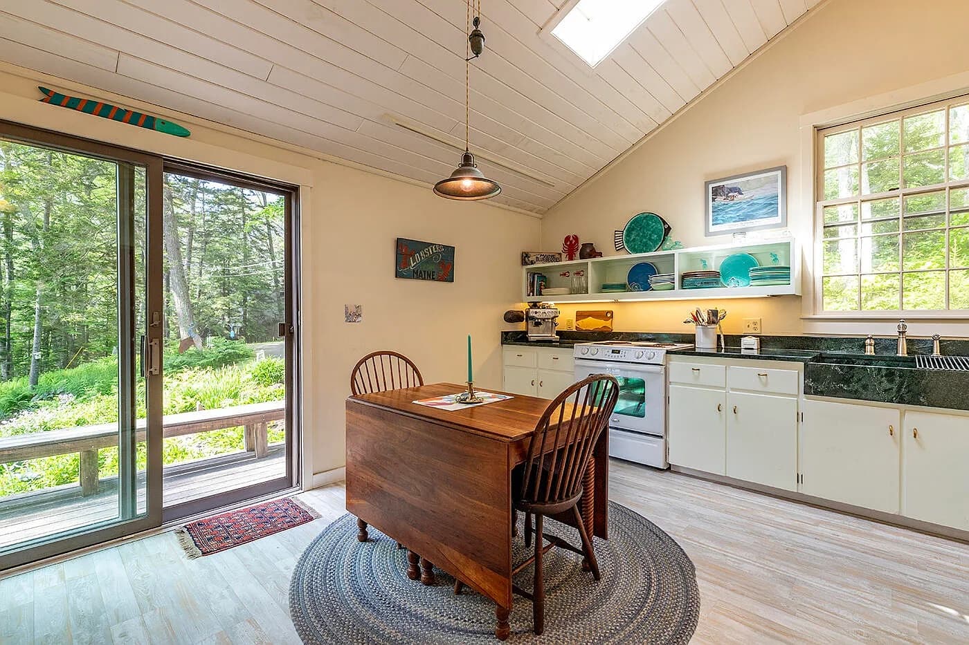 Kitchen with pendant light and wooden dining table